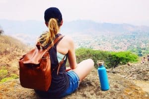 On of the best sustainable travel tips is to always carry a reusable water bottle.